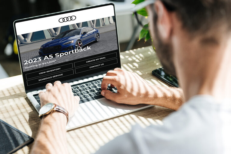 man using laptop with an SEO optimized landing page on the screen