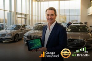 Dealership general manager reviewing organic search analytics on tablet in modern car showroom with vehicles displayed behind him